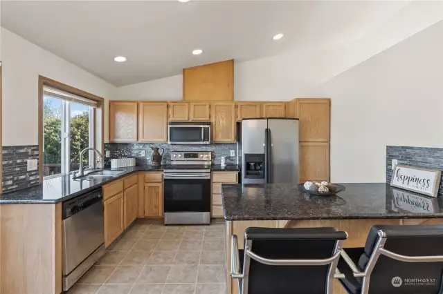 Beautiful kitchen with granite countertops and a large island for dining or entertainment