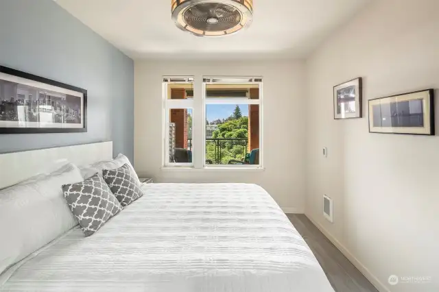 Bedroom looks out to the balcony and Mt. Rainier view.