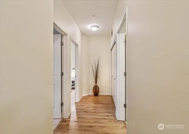 Down the hall bathroom and Laundry to your right, Primary and additional bedroom to your left!