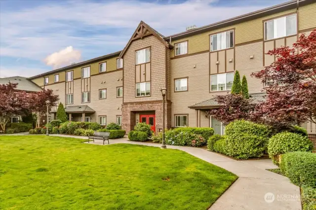Large grassy open area with your secure building entrance! Great for your 4 legged Family members!