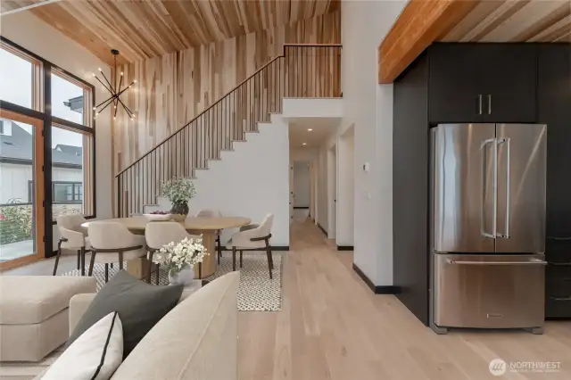 Virtually staged - living room with stairs leading up to second floor.