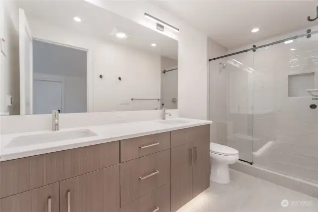 Upstairs second primary bathroom with walk in shower and heated floors