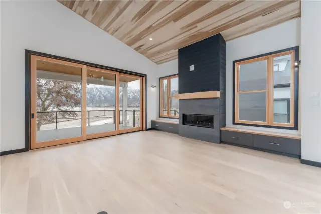 Living room with propane gas fireplace and oversize nesting sliding doors