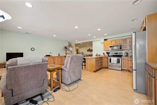 Looking from the entry doorway into the kitchen, common area and Living room in the background.