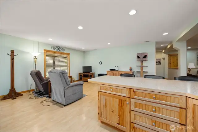 Set up for small gatherings, this common area could also be used a designated dining room.  View from the kitchen.