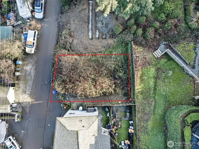 What a quaint little lot offering a possible low maintenance yard once built out.