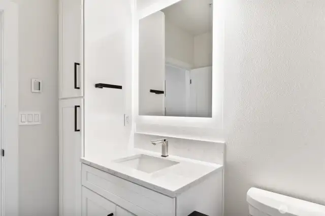 storage closet to the left of the sink
