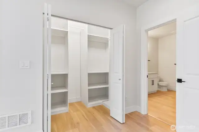Primary Entry - Walk in closet with built in shelving