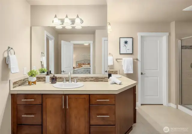 Ensuite bath features a double vanity with generous storage space