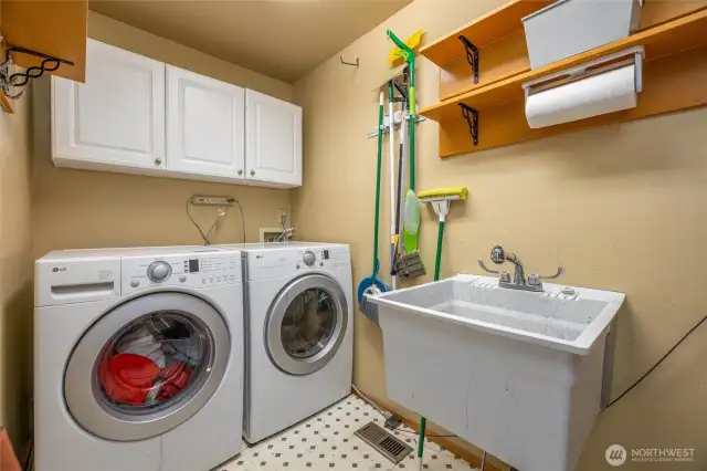 The laundry room is adjacent to the kitchen and dining area, and leads to the garage