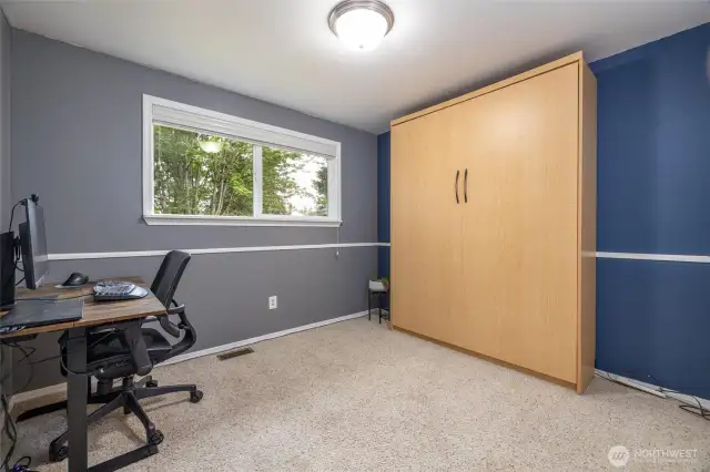 This is one of 2 bedrooms on the first floor. The murphy bed conveys with the property.