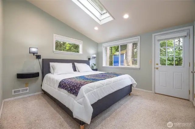 Upstairs is the primary suite, with vaulted ceilings. Light and bright.
