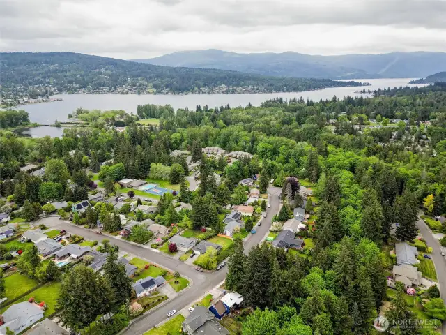 The home is visible in the middle bottom of the photo, showing it's proximity to the lake and park.