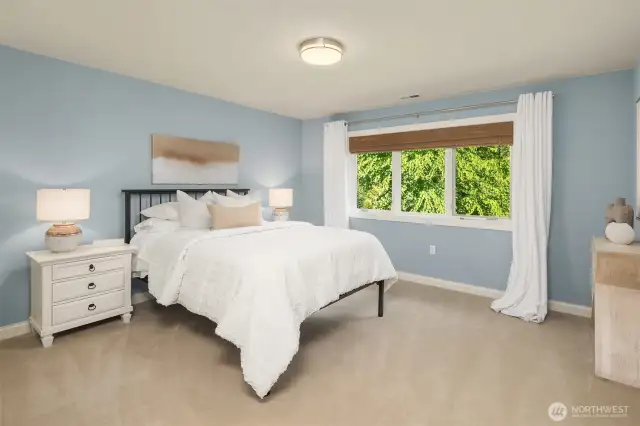 This bedroom is beautifully situated toward the views of the back yard.