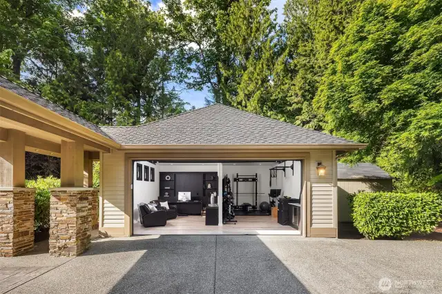 Detached 26' x 26' garage has become an office and work out space and is heated and cooled with two mini-splits.  This space has a roll up door and is really cool.  Detached storage shed is to the right of garage.
