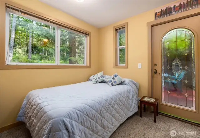 First level bedroom with door to secluded back deck
