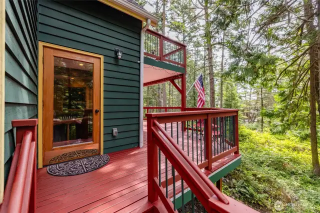 Generous, freshly stained decks surround the home