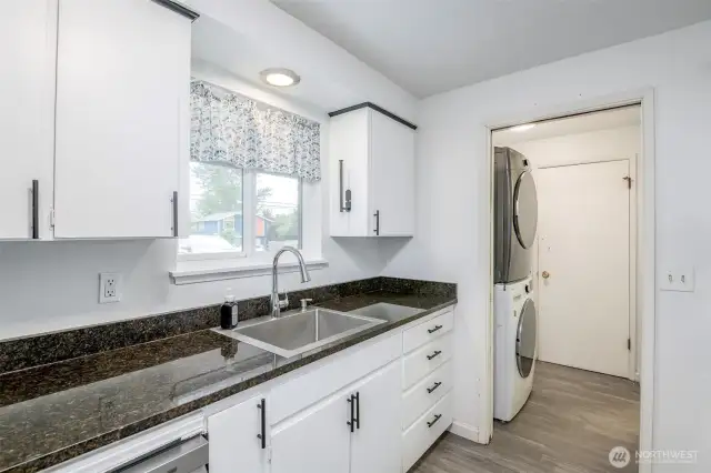 Washer and dryer, half bath, garage door.