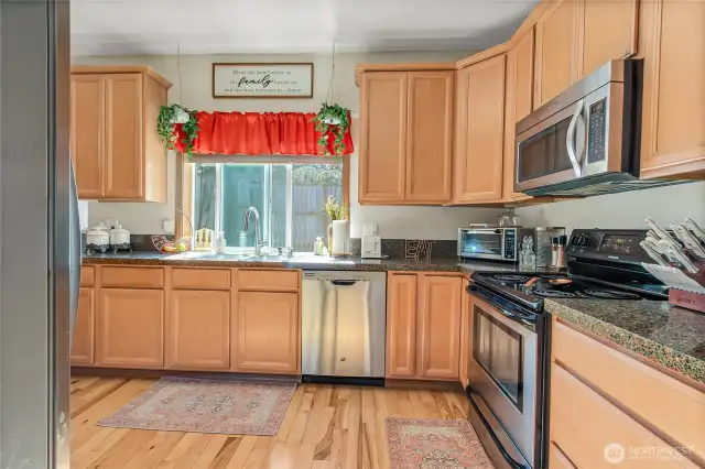 Gourmet sized kitchen, granite counters, stainless steel appliances and so many cabinets and counterspace areas.