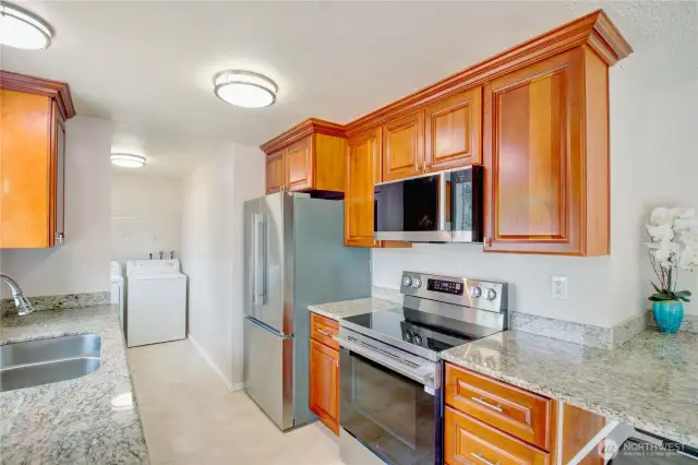 Updated Kitchen with granite counters, garden window, and brand-new stainless steel appliances!
