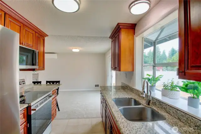 Updated kitchen with clean finishes and room to cook and gather