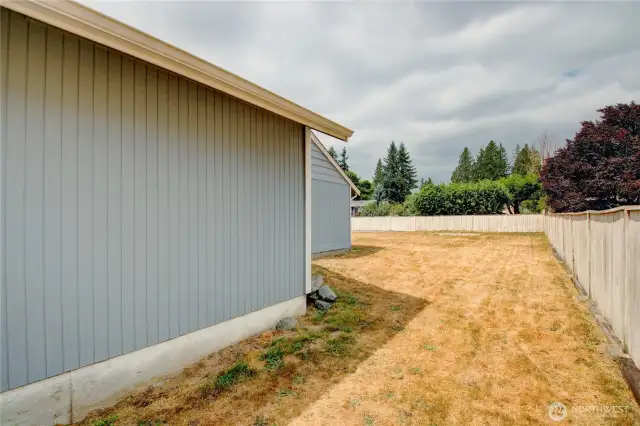 Double opening side yard gate gives easy access to backyard