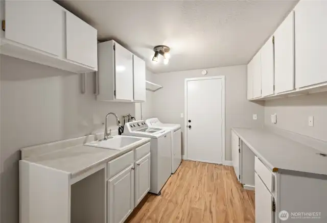 down stairs utility room that is roomy enough to alter to a kitchen