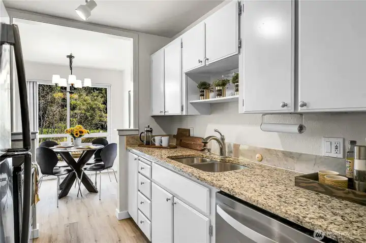 Plenty of storage in this galley style kitchen with new stainless appliances
