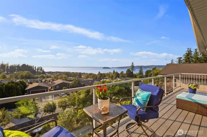 Composite/Trex deck wraps around the main level of the house and is the perfect place to take in the sunset or enjoy your morning cup of coffee.
