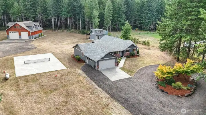 Discover all this exclusive property has to offer with renovated home, 2 shops, pickleball court, and acres of woods to explore
