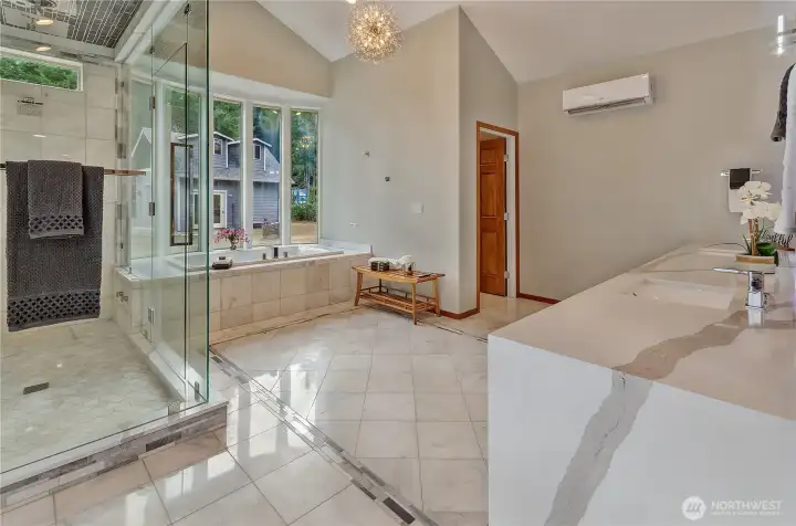 Steam, soak, and unwind - this spa-worthy bath wrapped in marble is waiting for you - complete with its own mini-split keeping you at the perfect temp year-round