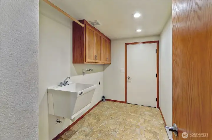 Well-placed utility room just off the garage keeps daily life running smoothly