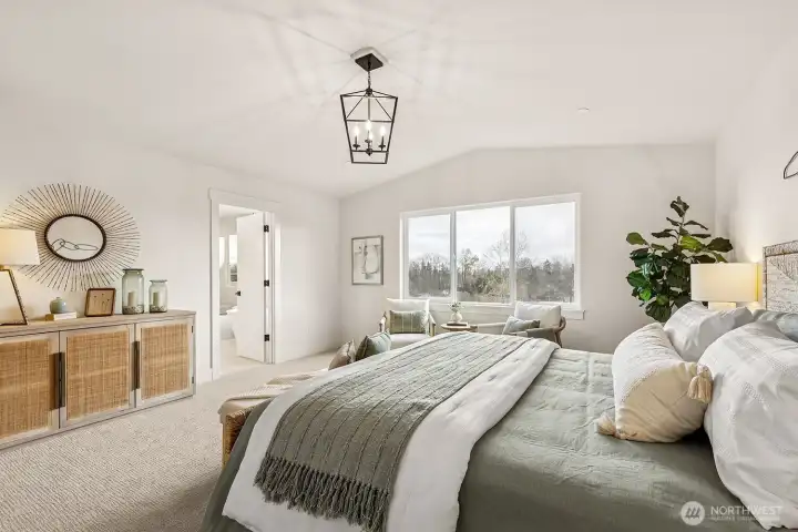 Photo of the exquisite primary bedroom with vaulted ceilings and beautiful territorial and mountain views located on lot 4 at Moorlands Grove.