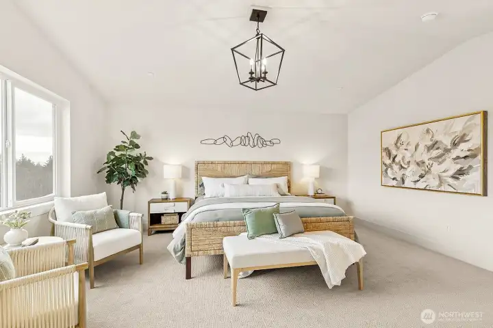 Photo of the exquisite primary bedroom with vaulted ceilings and beautiful territorial and mountain views located on lot 4 at Moorlands Grove.