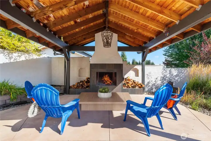 Gather fireside under the covered patio—an ideal space for evenings, entertaining, and four-season enjoyment Gather fireside under the covered patio—an ideal space for evenings, entertaining, and four-season enjoyment