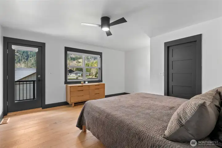 Wake up to natural light and step outside—primary suite designed for comfort and connection to the outdoors