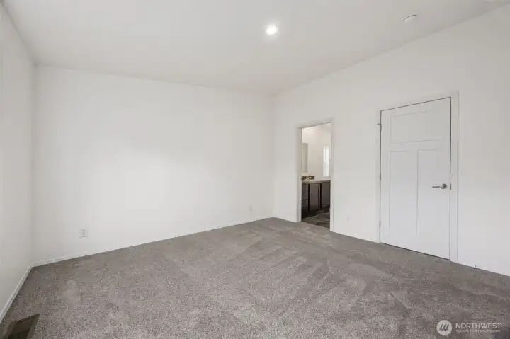 This angle shows why split-bedroom layouts are so popular. The primary suite is set apart from the other bedrooms, giving you a little breathing room and a lot more quiet. The walk-in closet and en suite bath are tucked right into the suite, keeping everything efficient and easy. It’s a thoughtful layout choice that makes the home feel more polished and grown-up.