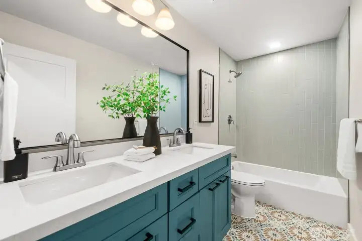 Hall bathroom with double sinks
