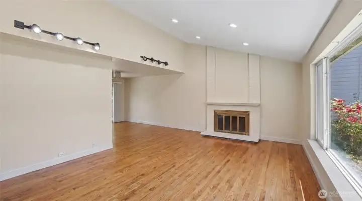 A cozy fireplace anchors the room.