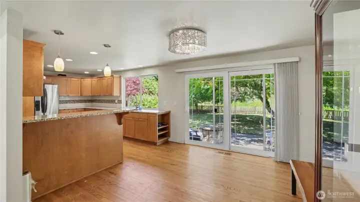 Bright dining area overlooking the backyard with easy access to outdoor entertaining spaces.