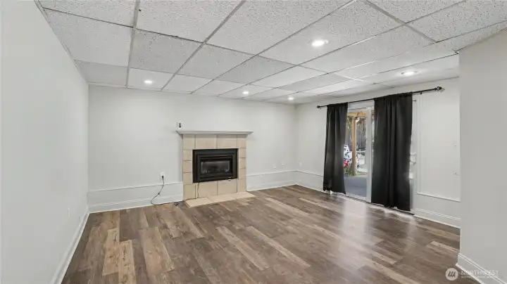 Good-sized lower-level family room. Direct access to outdoor living spaces.