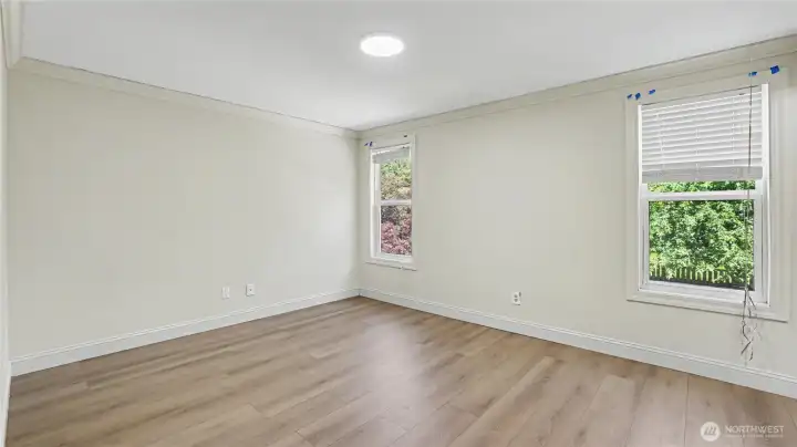 Spacious primary suite offers a peaceful retreat.