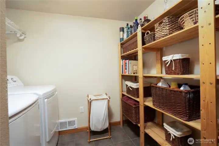 Spacious utility room with tile flooring.