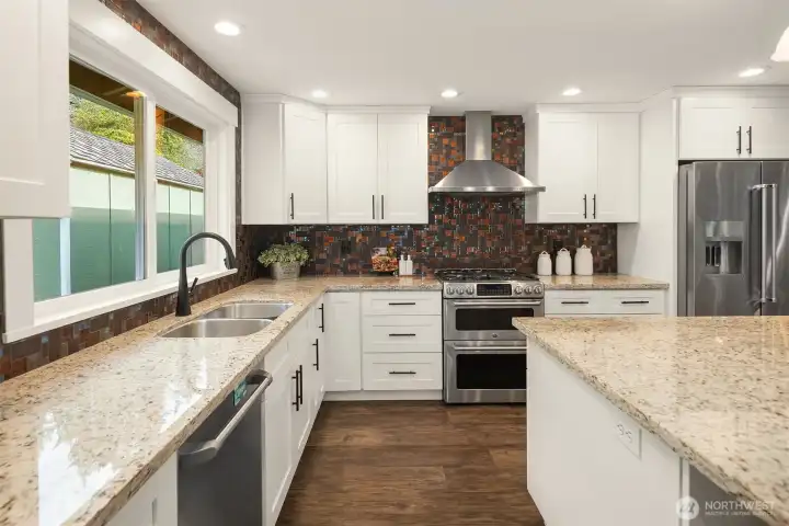 Fresh trim and craftsman doors, and LVP flooring throughout. Newer Milgard Tuscany vinyl windows, two-way blinds, newer 95% efficiency furnace and water heater. Newer outlets, fixtures and recessed lighting.