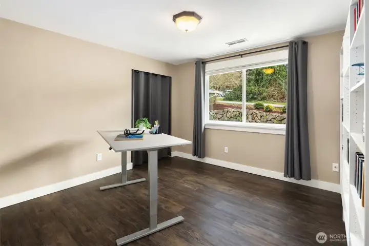 Bedroom 2 with built-in shelving.