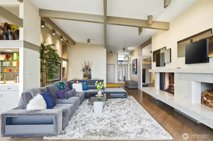 Another photo of living room that look back toward foyer and front doors.
