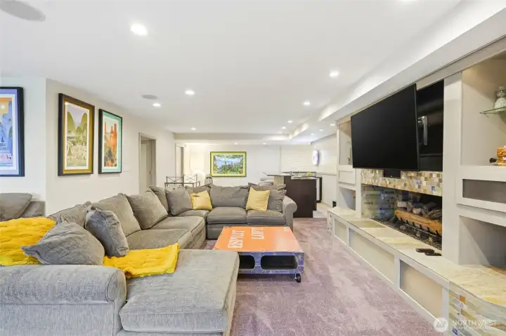 Rec room looking back at wet bar.  Door located on the left behind the couch is a great area for small exercise area.