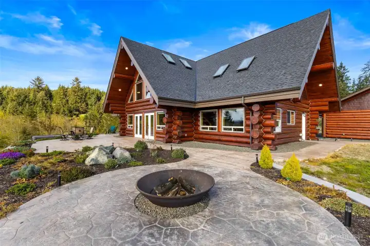 Custom Log Home with VIEWS! Stunning details throughout.  Massive stamped concrete patio with this fabulouis fire pit
