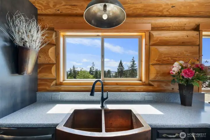Watch the boats sail along the Hood Canal from the lovely copper sink in the kitchen