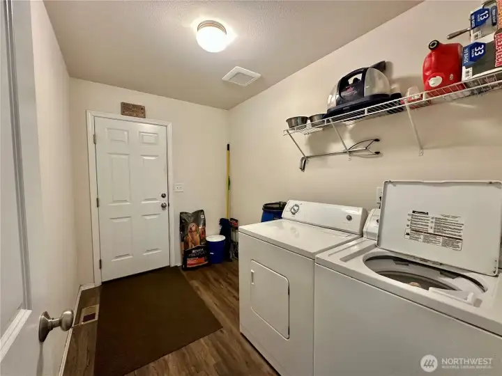 Laundry off kitchen leading into garage
